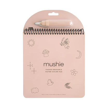 Wiederverwendbares wassermalbuch feen mit pinkem mushie fairies block und beige wasserpinsel an schwarzer spiralbindung