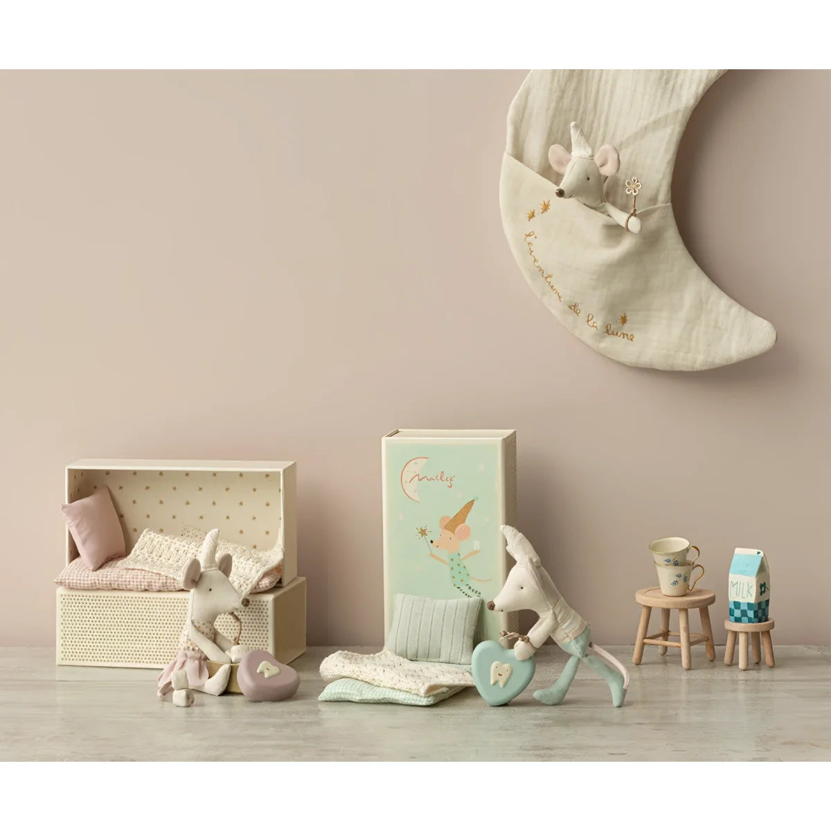 Crescent moon-shaped pillow with small stuffed animal Zahfeenmaus attached
